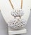 1972 Modernist goldtone two oval graduated bumpy white enameled pendants on a chain necklace with spring ring clasp....