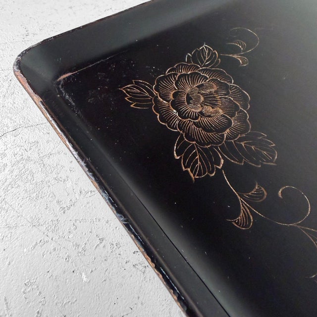 Graceful Japanese obon tray with a wooden core, finished in deep black lacquer and subtly decorated with two peony...