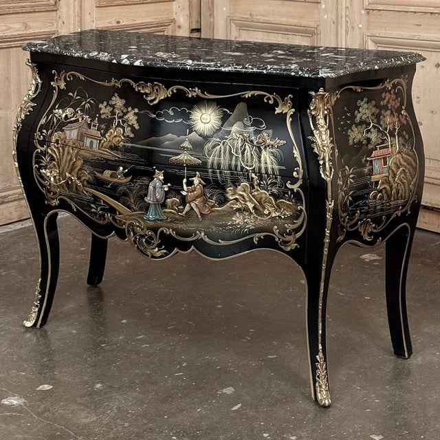 Antique French Chinoiserie Black Lacquer Bombe Commode showcases the French adaptation of what was then termed the Style...