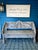 A wonderfully sculptural vintage hand-carved teak bench from Indonesia, featuring an extraordinary backrest with opposing...