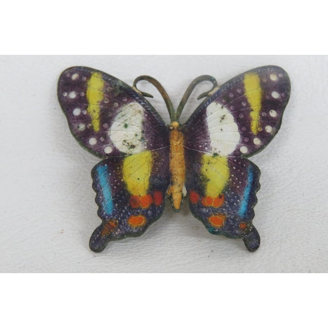 This lovely Butterfly Brooch Pin is made out of metal. This darling brooch features a butterfly style shape with a...