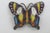 This lovely Butterfly Brooch Pin is made out of metal. This darling brooch features a butterfly style shape with a...