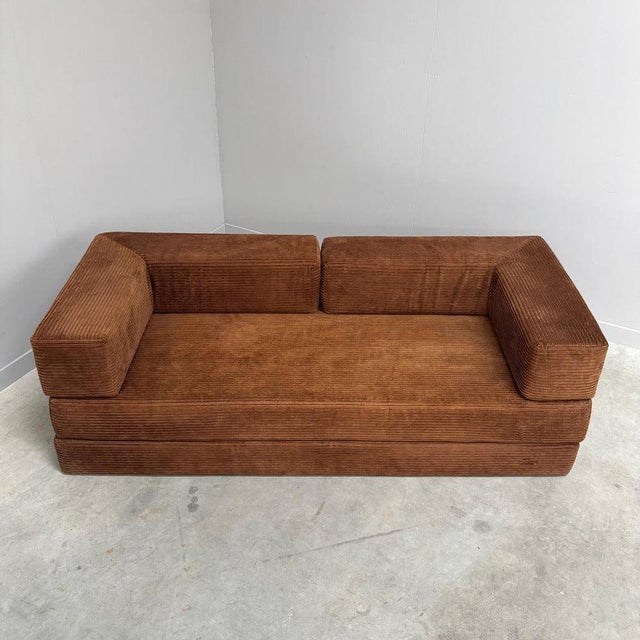 Remarks: Mid century sofa / daybed Germany 1970s. All elements upholstered with brown corduroy fabric. Sofa is in...