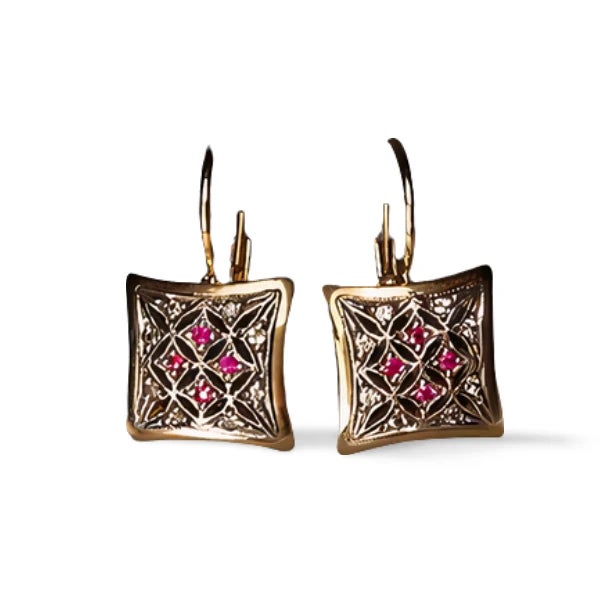 Charming antique 14K pink gold earrings featuring rose cut diamonds and natural rubies, offering timeless vintage...