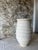 A beautifully substantial oversized ceramic vessel, featuring a softly textured matte finish and sculptural ribbed...