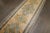 An authentic antique oushak runner. Accents in powder blue and mustard on a bone colored field and border. 3'1'' x 17'5''