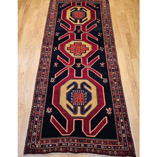 "This striking vintage wide runner from Northwest Persia, dating to the third quarter of the 20th century, exemplifies the...