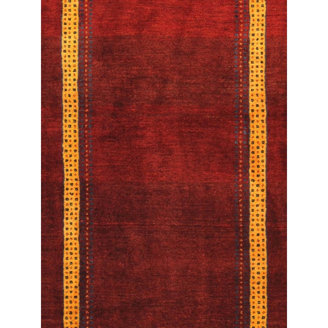 Gabbeh Hand-Knotted Area Rug is handmade with extra high pile and very simple, stylized designs. They are constructed from...