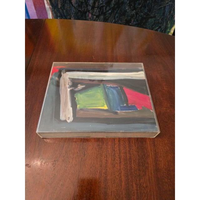 A fine mid century modern small abstract painting in an enclosed lucite frame. Very well painted all hand painted (...