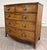 This is an elegant antique Federal / Hepplewhite style bowfront mahogany chest of drawers dating to the early 19th...