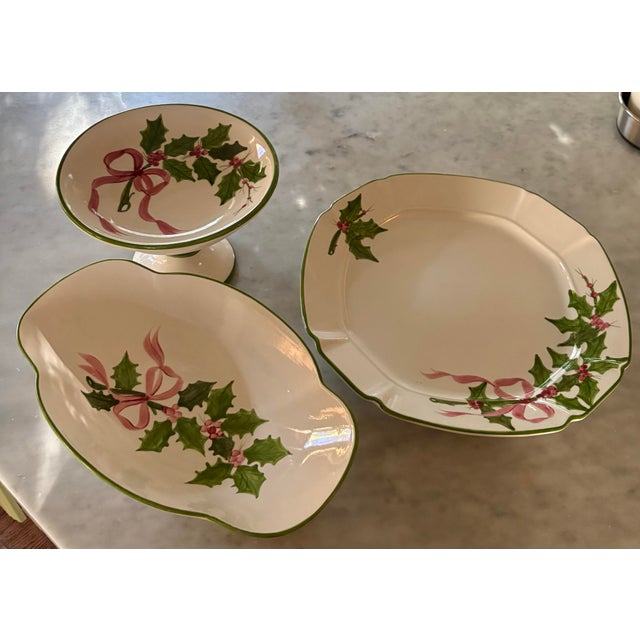 Vintage hand painted pattern. Soft cream earthenware base. Holly leaves and pink ribbon/ bows. Oval bowl 13” x 8” x 2.5”....