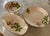 Vintage hand painted pattern. Soft cream earthenware base. Holly leaves and pink ribbon/ bows. Oval bowl 13” x 8” x 2.5”....