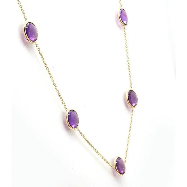 This is part of Chairish’s Fine Jewelry assortment. Amethyst Station Necklace studded with round cut amethyst studded on a...