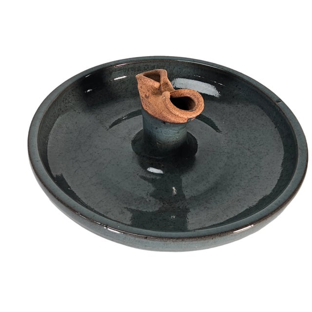 This is a vintage sculptural bowl in a dark green crackle glaze. It features a central two opening spout. It is unsigned...