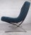 Two vintage-modern Knoll-style Italian lounge chairs featuring x-shaped chrome bases, 16.5" seat height, and tufted...