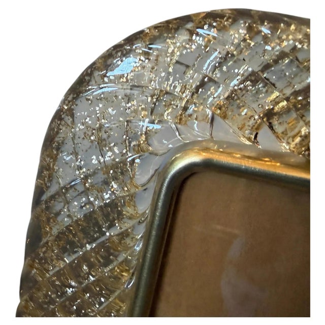 A clear and gold murano glass picture frame designed and manufactured in Venice in the style of Barovier, it's in lovely...