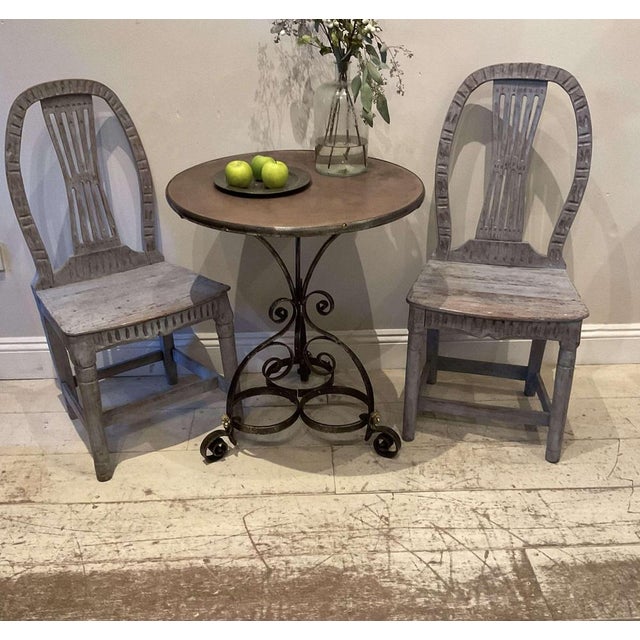 A charming matched set of three C19th painted folk chairs. There are two side chairs and one carver. All three have been...