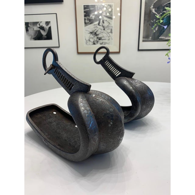 A pair of antique Japanese Abumis, stirrup for horse-riding, in cast iron with elaborate silver inlay, circa 16th century...