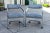 A pair of 1980s chromed metal frame cantilevered chairs on casters attributed to Milo Baughman for Design Institute of...