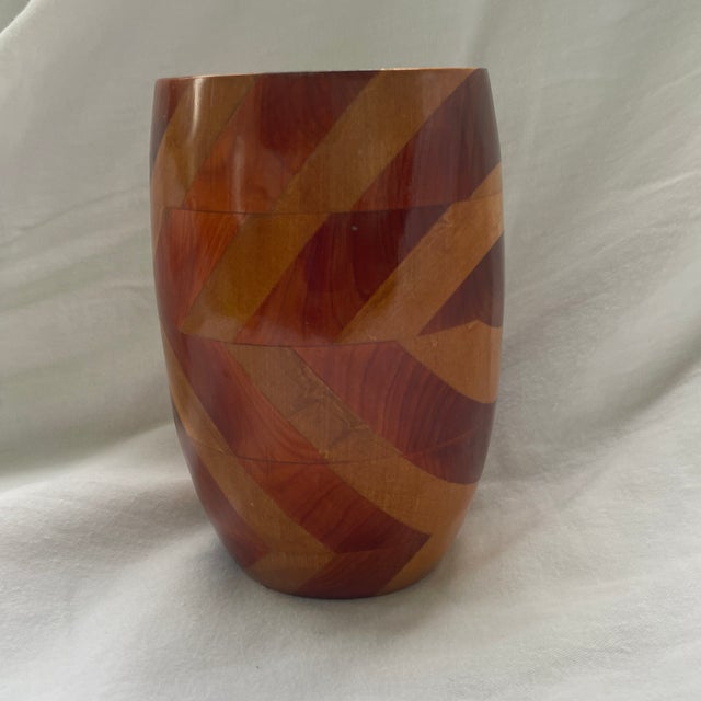 The Mid Century Modern Hand Crafted Multi-Wood Vase is a unique and stylish home décor piece handmade in the United...