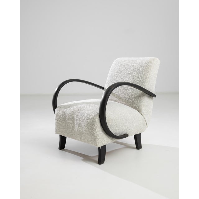 Introducing the 1950s Czech Wooden Armchair by J. Halabala, a timeless piece that combines vintage charm with modern...