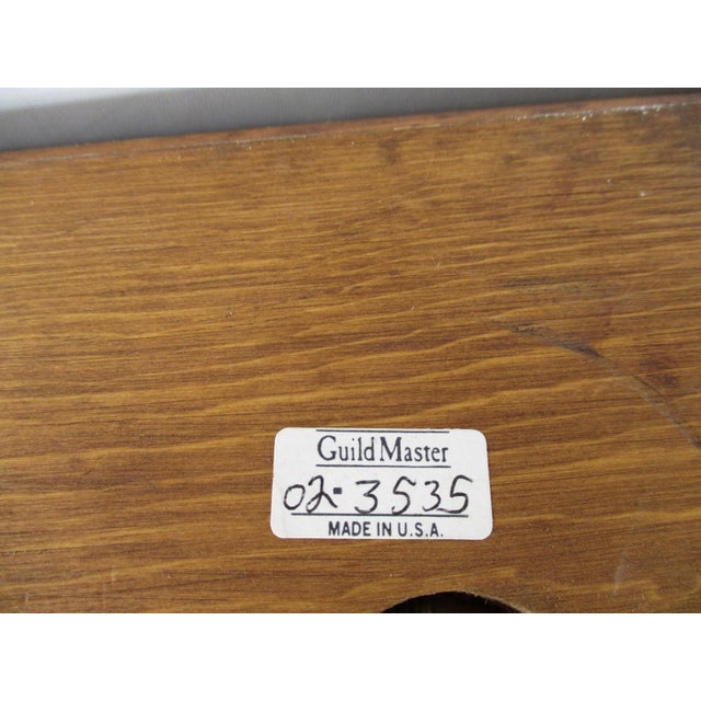 The Art Lamp Purse by Guild Master is a unique and original decorative collectible piece that combines mixed materials in...