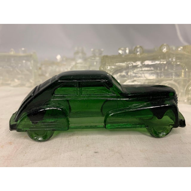 Vintage Glass Candy Container Collection of Eight Automotives. The descriptions of each are as follows: 1.) Green Glass...