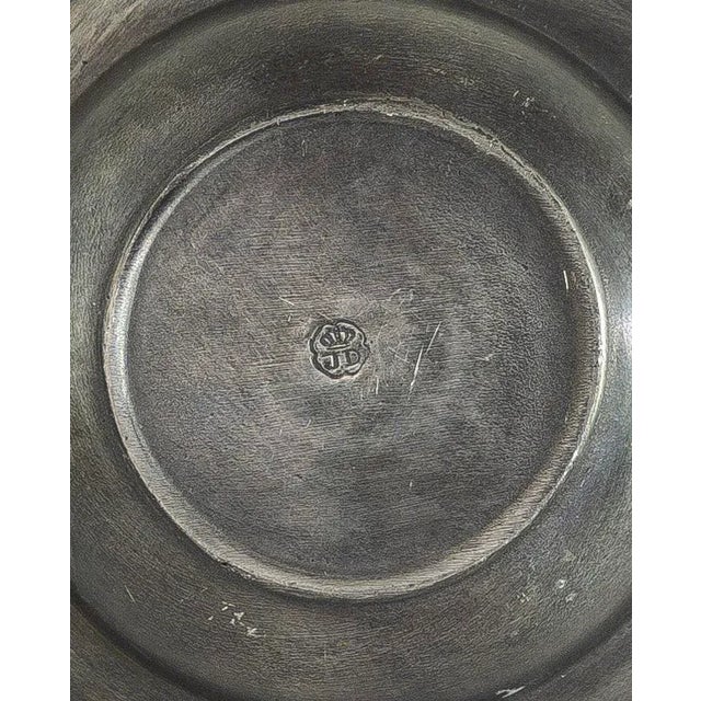 This is a single reeded, rimmed European pewter bowl dating from the 18th century or perhaps as late as early 19th...