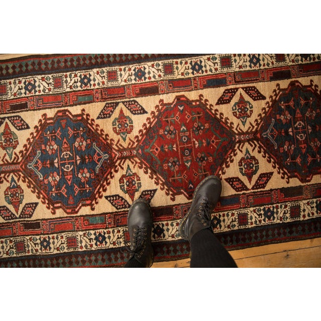 :: Single column center medallions each with interior geometric floral bouquets enveloped by hook and latch motif and...