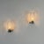A refined pair of Italian wall sconces from the 1970s, executed in the unmistakable style of Gino Sarfatti and Seguso...