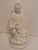 A serene vintage Blanc de Chine porcelain figure of Guanyin, the Buddhist Goddess of Mercy and Compassion. Crafted in...