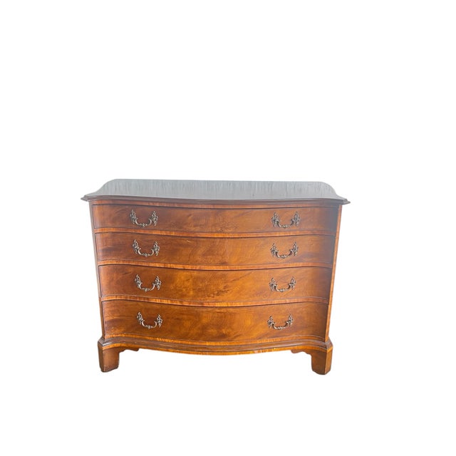 Gorgeous Chippendale style Mahogany serpentine chest of drawers by Old Colony Furniture Co . The stunning veneered...