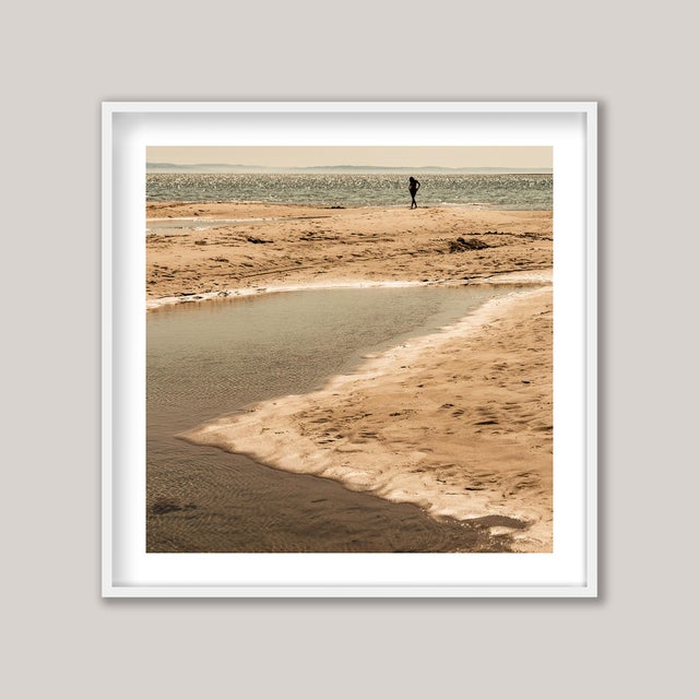 The Hottest Day - Early afternoon at low tide on England’s southern coast. A young woman returns from a dip in the sea,...