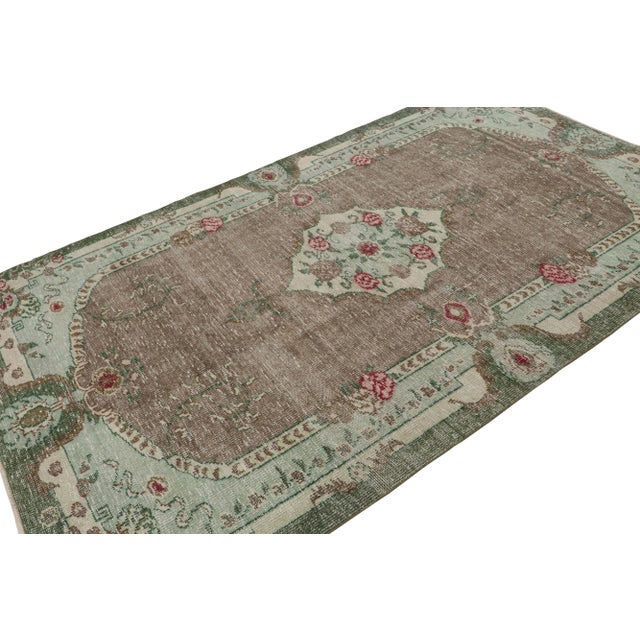 Hand Knotted in wool circa 1960-1970, this 5x9 vintage Turkish rug is believed to be among the rare works of mid-century...