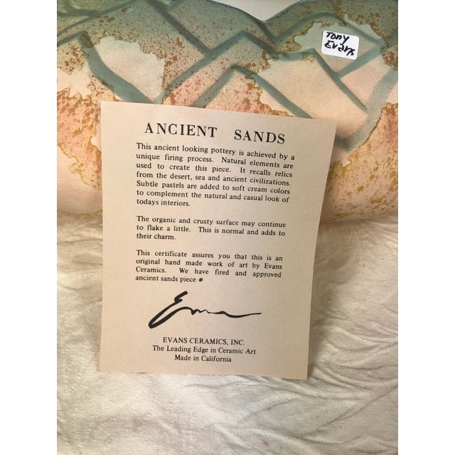 Unique large vintage ceramic sculpture by Tony Evans. Large vessel in earth tones of Pink Salmon, Rust and Turquois Green....