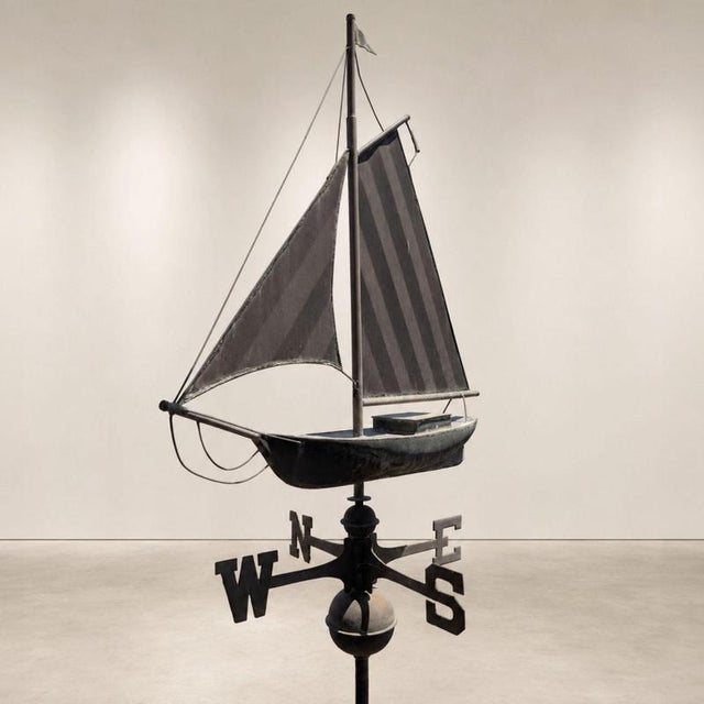 A rare copper weathervane from the early 1900s, featuring a three-dimensional structure depicting a sailboat. The...