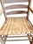 Handcrafted hickory rocking chair featuring a traditional ladder-back silhouette, bark-on posts, steam-bent slats, and a...