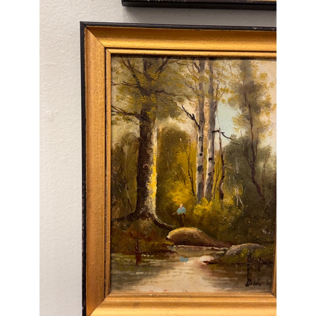 This 19th century French oil on canvas depicts a tranquil woodland scene with a river winding through tall trees, painting...