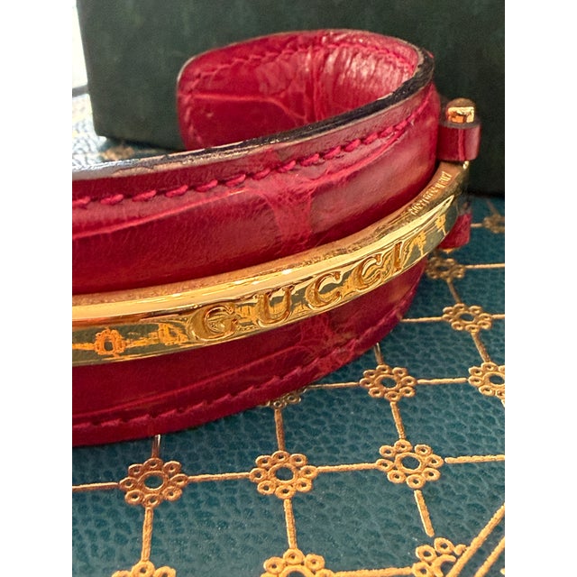 1990’s Gucci Red Crocodile Style Leather Bracelet With Gold Tone Engraved Logo Narrow Horse Bit For Sale - Image 9 of 11