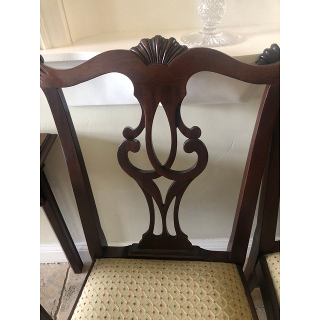 Double pedestal mahogany dining set with banded table and eight chairs. Stickley. Good used condition. Measures 112" X 44"...