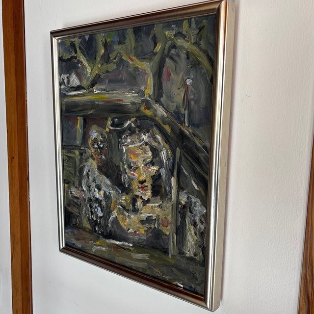 I love this painting depicting two figures in a car. Both figures gaze out of the window, but it is the woman at the front...