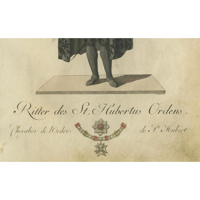 Knight of the Order of Saint Hubert: 1791 Hand-Colored Engraving in Formal Attire This impressive hand-colored engraving,...