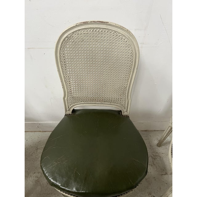 A beautiful set of seven louis xvi style chairs in patinated beechwood. four turned legs with recessed fluting. round...