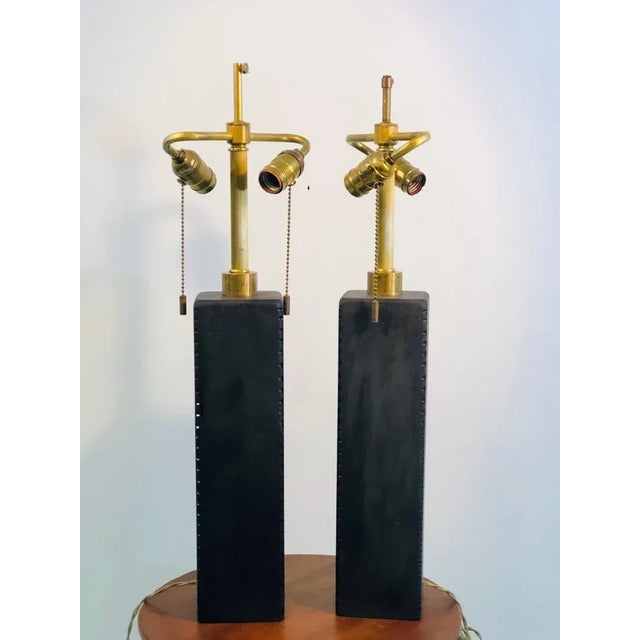 Modernist pair of unusual Black Sandblasted Glass lamps.1990’s, signed Donghia. In good condition. Measures 25” high by 4”...