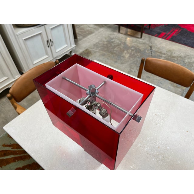 The Vintage Italian Red Acrylic Table Lamp from the 1980s is a bold and stylish lighting fixture. With its vibrant red...