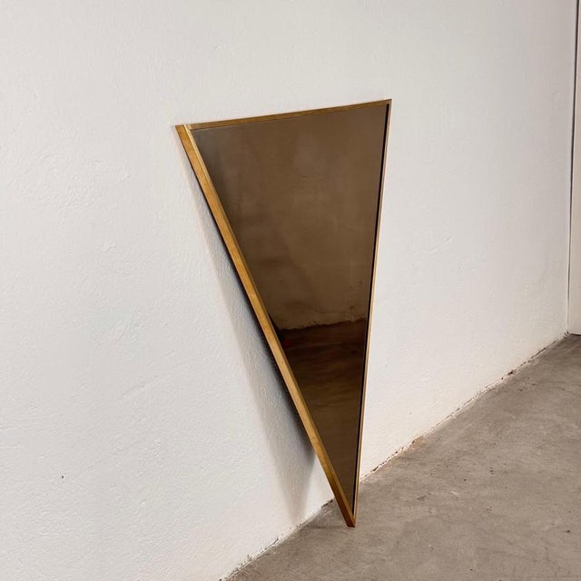 A rare and evocative triangular mirror by the great architect Sandro Petti, designed in Rome in the 1970s. Created on...