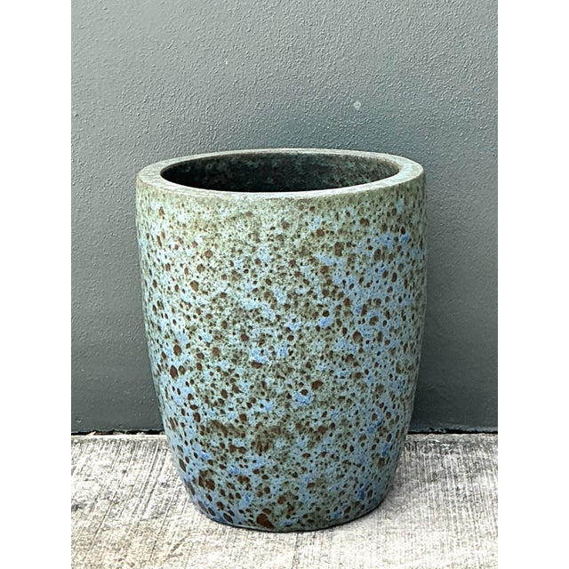 This monumental ceramic planter is a striking example of Mid-Century Modern inspired pottery, featuring a captivating...