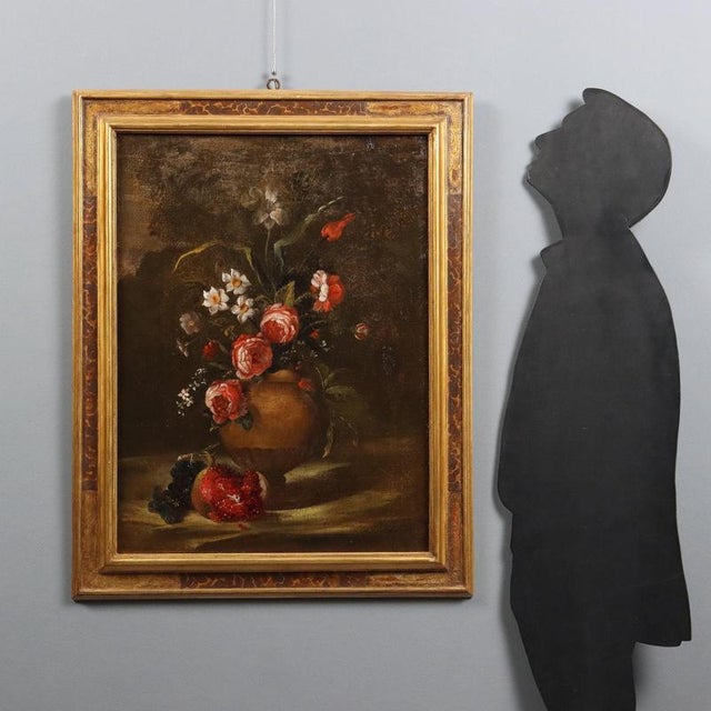 Oil on canvas. Central Italian School, 18th century. An amphora vase contains a composition of variegated flowers, with...