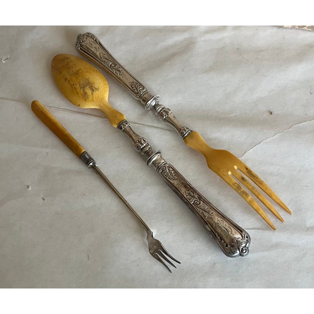 Serving spoon and fork along with a pickle fork Victorian era meant a well dressed table had a utensil for every type of...