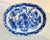 The Chinese export blue & white oval platter featuring depictions of wise men, a tiger, and a dragon likely reflects...